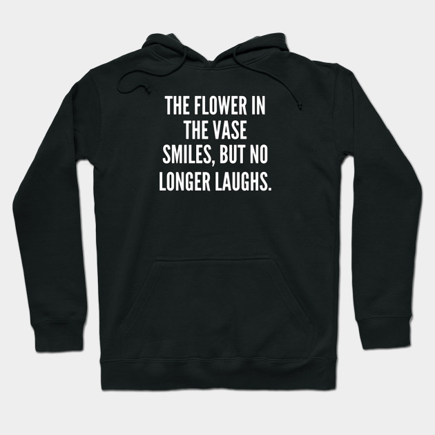The flower in the vase smiles but no longer laughs